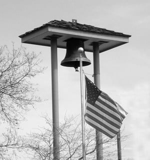 black and white bell with USA flag