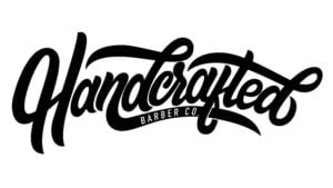 Logo of &quot;Handcrafted Barber Co.&quot; in cursive script.