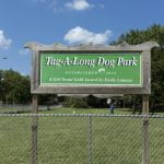 Tag-A-Long Dog Park entrance sign, established 2016.