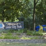 Morris Lions City Park entrance sign with playground