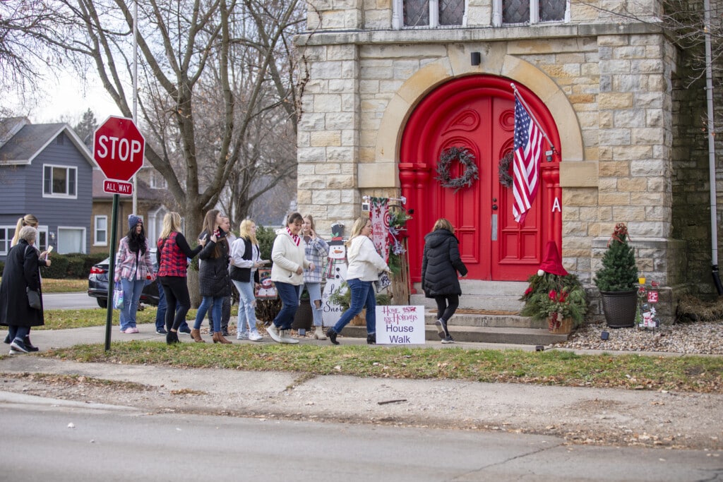 Group at holiday home tour entrance.